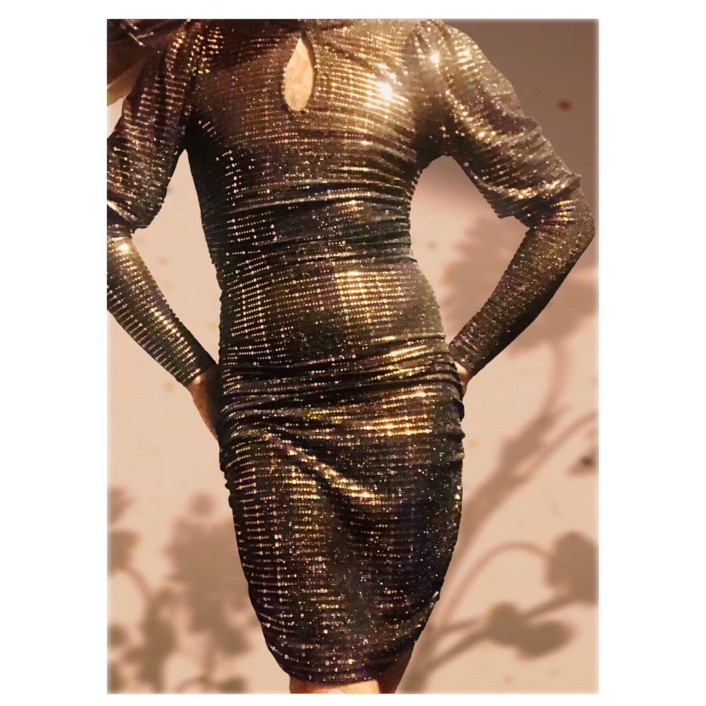 Hand made black cocktail/party dress adorned with copper coloured sequins.